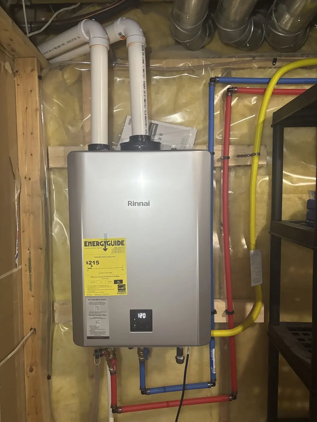 Rinnai tankless water heater installed with PVC venting and gas line